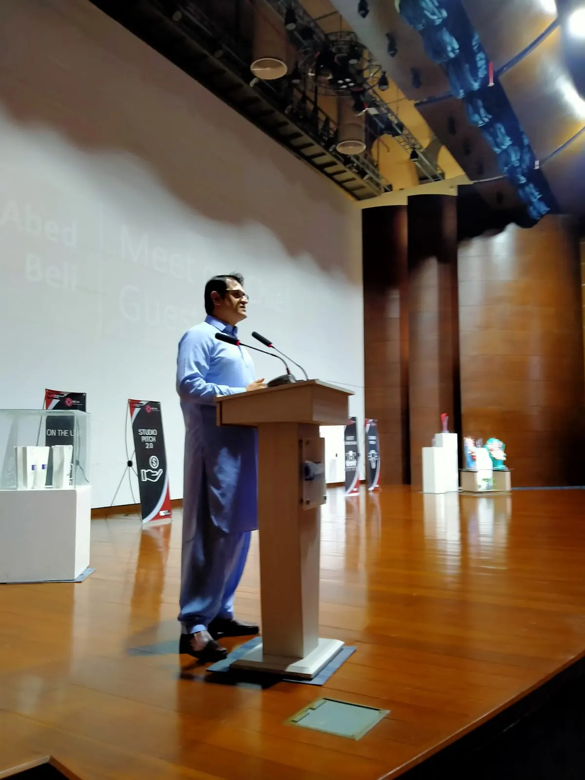Abid Beli speaking at an event